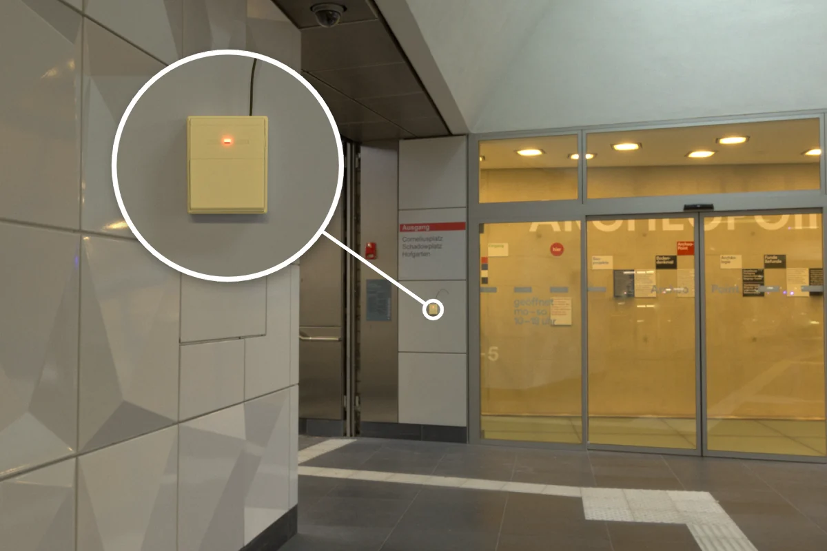 Glass automatic door with CS-732F wireless remote receiver on the wall beside it for remote door opening