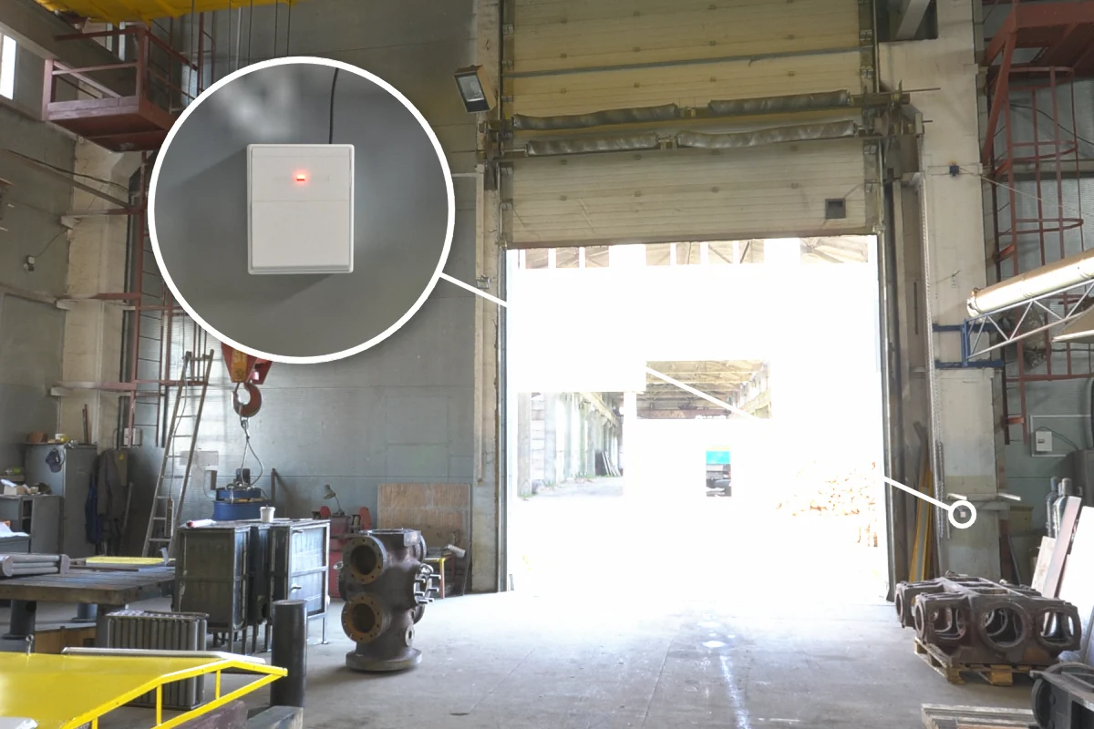 Factory entrance sectional door with CS-732F wireless remote receiver on the column, opened by remote from the forklift