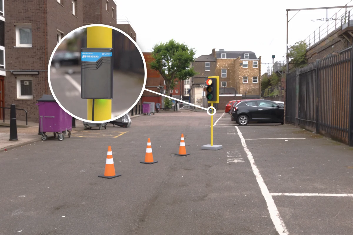 Road works temporary traffic light with RD-710F-433 rolling door remote controller mounted on the pole, signals switched by remote control