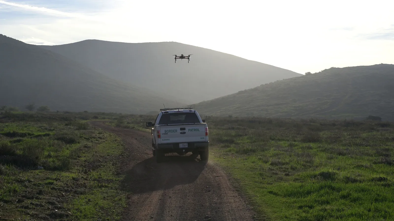 Border patrol vehicle and uav in hilly terrain
