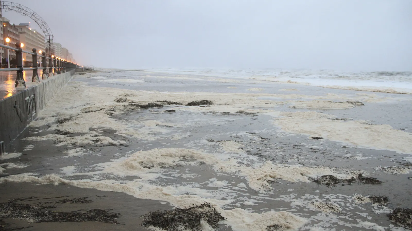 Storm waves overtopping a seawall promenade