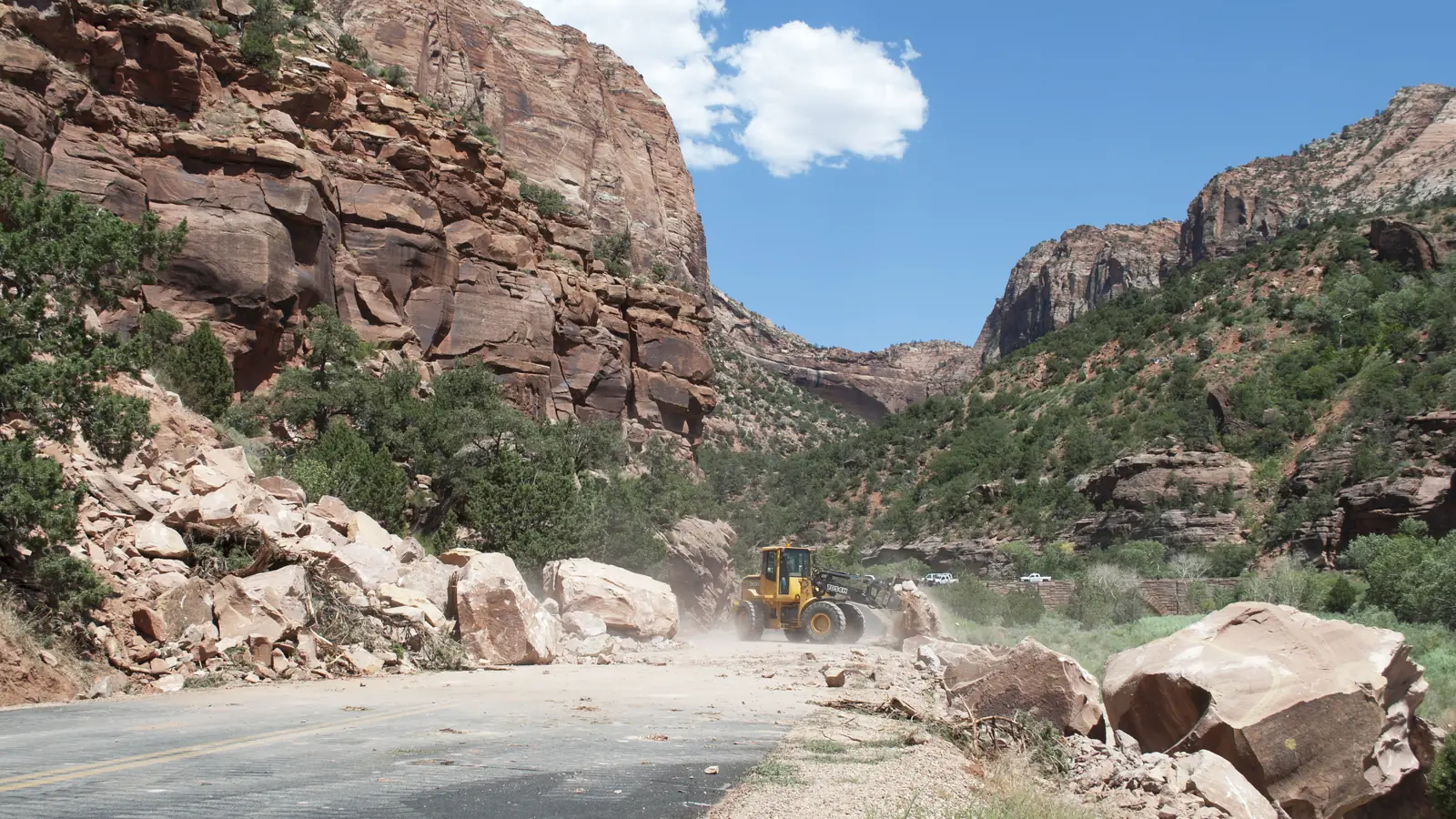 Rockfall on a mountain highway being cleared