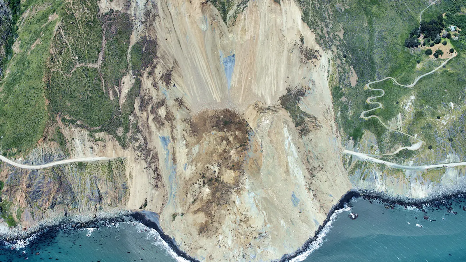 Large landslide burying a coastal highway