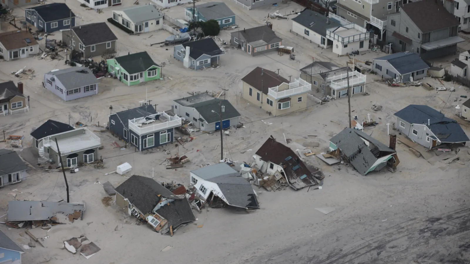 Aerial view of coastal homes damaged by a hurricane